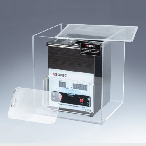 Atveriet kluso kasti, kurā atrodas 2 litru ASONIC ultraskaņas tīrītājs, kas paredzēts trokšņa samazināšanai darbības laikā.